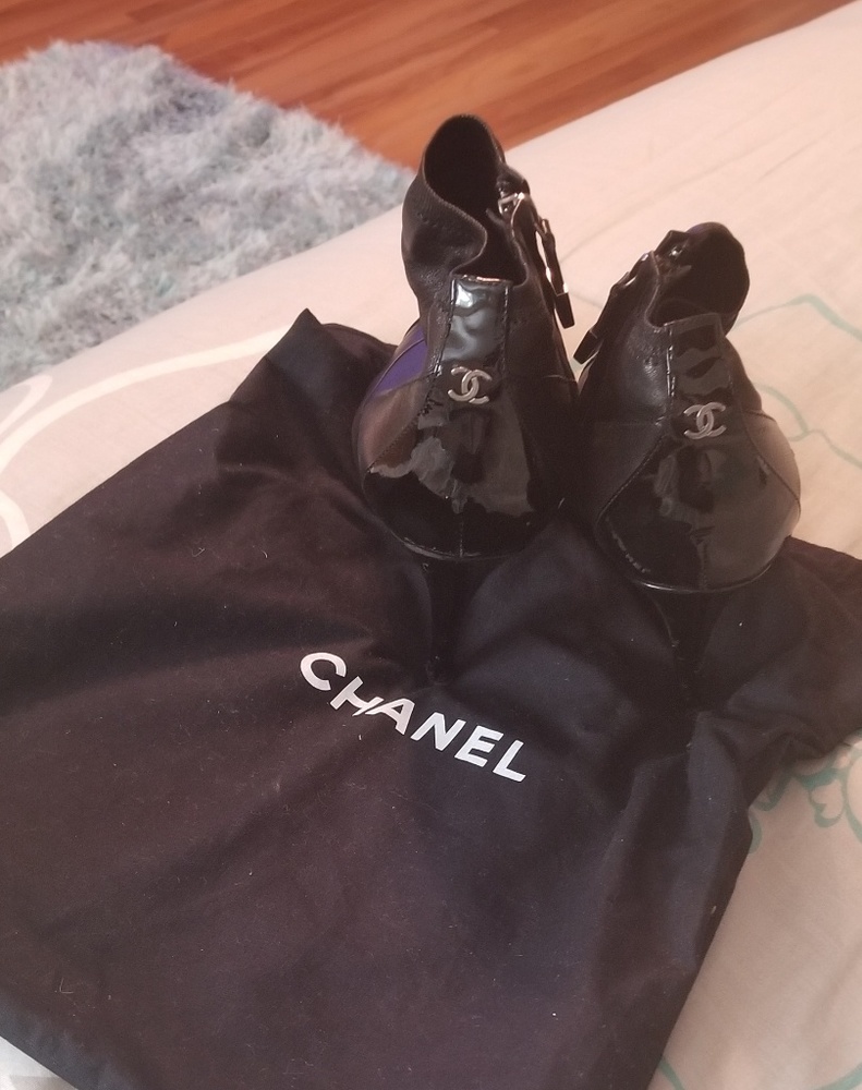 Black CHANEL leather cap toe bootie.. AUTHENTIC